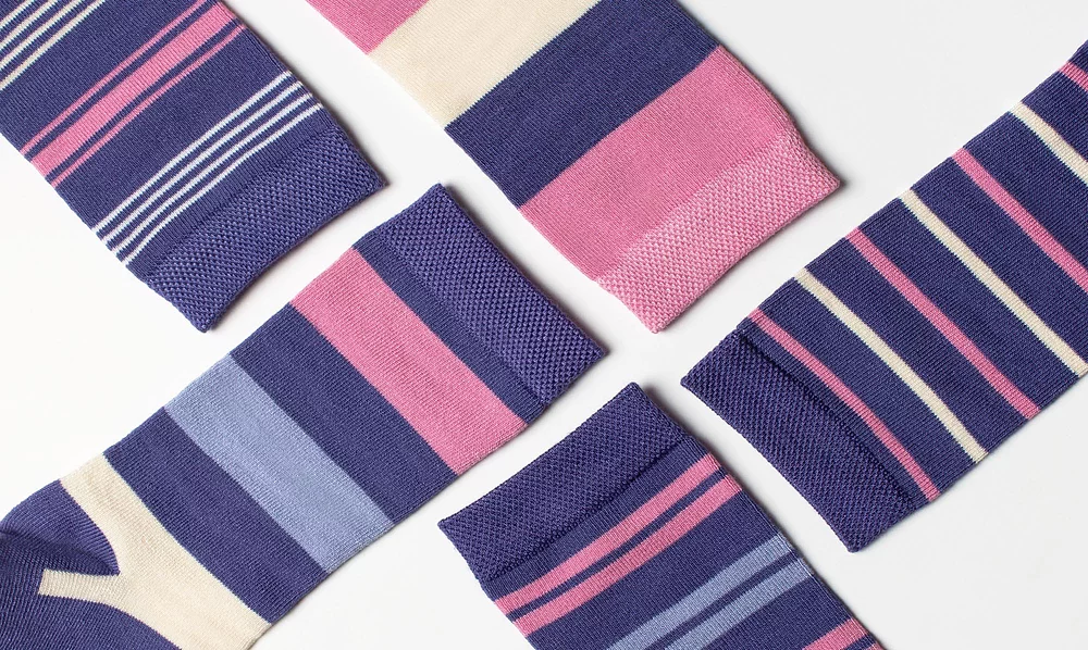Close-up of women's pink and sky blue coloured spotty bamboo socks