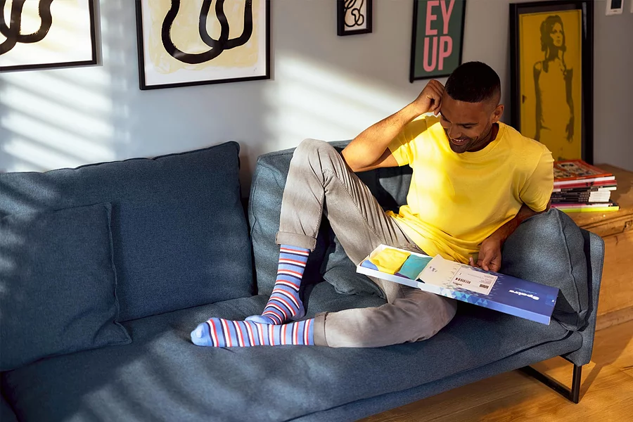 Man wearing blue and red striped bamboo socks