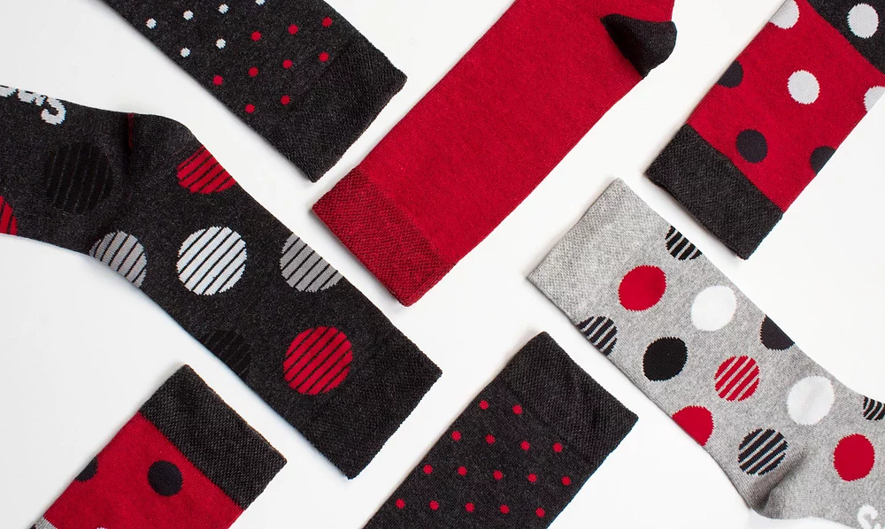 Close-up of men's striped design black and red socks