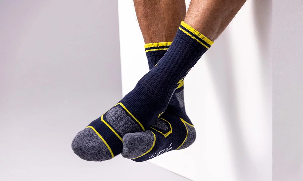 Four pairs of men's navy and yellow coloured work boot socks