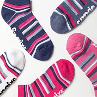 Close-up of woman wearing pink bamboo cushioned trainer socks
