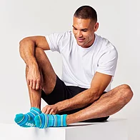 Man wearing plain white bamboo trainer socks